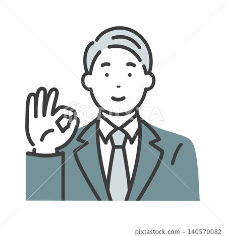 A middle-aged businessman gives an OK sign. A middle-aged businessman gives an OK sign. 140570082