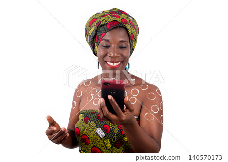 woman in traditional clothes talking on the phone woman in traditional clothes talking on the phone 140570173