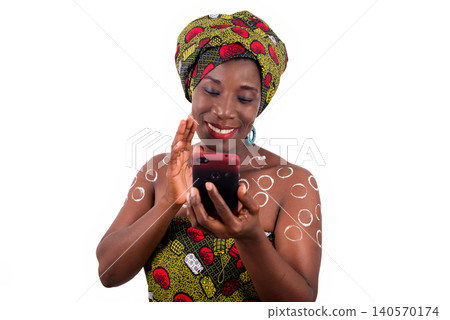 woman in traditional clothes talking on the phone 140570174