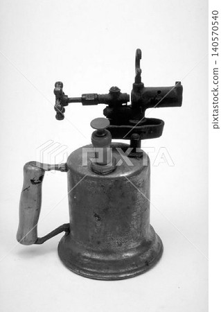 A realistic image of a Vintage Brass Blowtorch with Pressure Pump Handle A realistic image of a Vintage Brass Blowtorch with Pressure Pump Handle 140570540