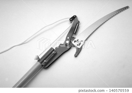 A realistic image of a Manual pole pruners isolated on a white background A realistic image of a Manual pole pruners isolated on a white background 140570559