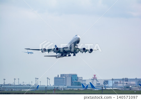 A jumbo jet begins its takeoff bound for overseas. 140571097