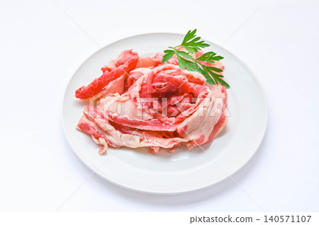 Thinly sliced raw beef brisket served on a white plate Thinly sliced raw beef brisket served on a white plate 140571107