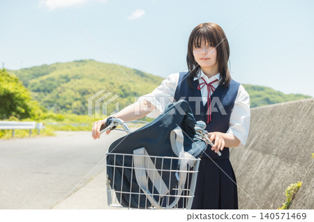 High school girl who commutes to school by bicycle High school girl who commutes to school by bicycle 140571469
