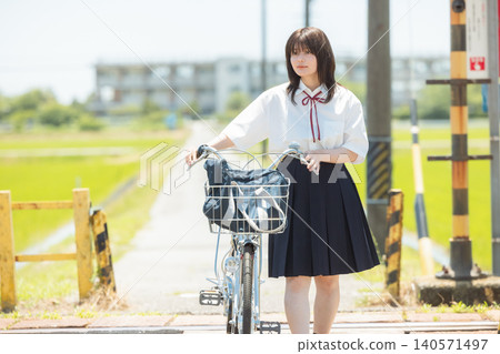 School girls who go to school by bicycle School girls who go to school by bicycle 140571497