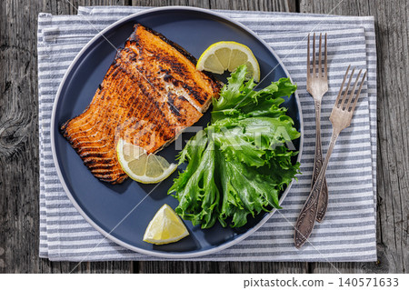 BBQ salmon fish on plate with fresh salad BBQ salmon fish on plate with fresh salad 140571633