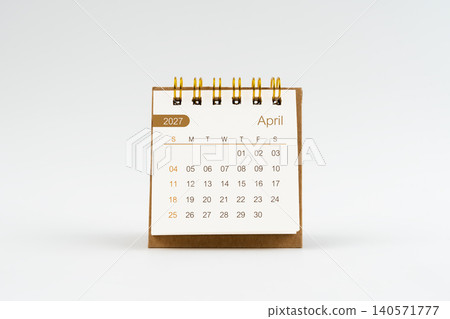 April 2027 Mini desk calendar on white background. April 2027 Mini desk calendar on white background. 140571777