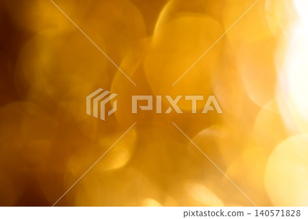 A sparkling background that shines with a golden light A sparkling background that shines with a golden light 140571828