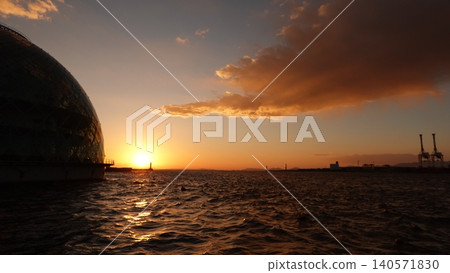 A dome-shaped building floating on the sea and a beautiful sunset. A dome-shaped building floating on the sea and a beautiful sunset. 140571830