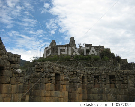 The dwellings of the Machu Picchu ruins, built on a slope. The dwellings of the Machu Picchu ruins, built on a slope. 140572095