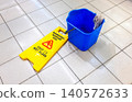 Caution Wet Floor warning sign on a tile floor 140572633