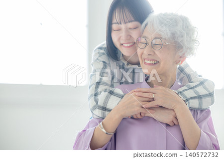Grandchild and senior woman Grandchild and senior woman 140572732