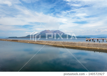 A view of Sakurajima volcano beyond the Kamoike Long Waterway and Kinko Bay. 140572927