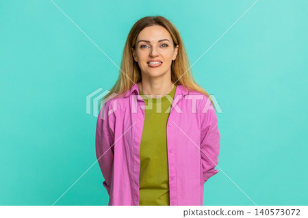 Woman sticking out tongue teasing with playful expression showing fun joke or mild mocking gesture Woman sticking out tongue teasing with playful expression showing fun joke or mild mocking gesture 140573072