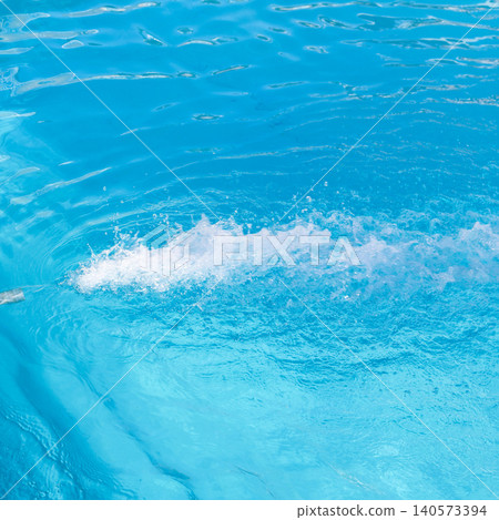 Powerful Water Jet Filling a Pool, Captivating Splash and Flow Creating a Refreshing Oasis Under the Sun 140573394