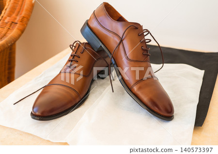 A pair of new men's leather boots, photos from different angles 140573397