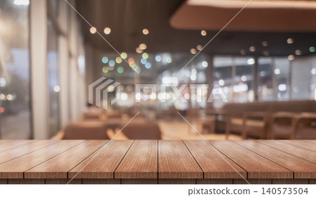 Empty wooden table top with lights bokeh on blur restaurant background. Empty wooden table top with lights bokeh on blur restaurant background. 140573504
