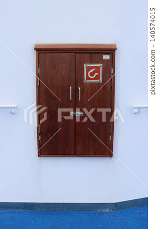 Wooden door where the fire extinguishers on the cruise ship are stored. Wooden door where the fire extinguishers on the cruise ship are stored. 140574015