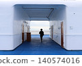 The back view of a woman walking on the deck of a cruise ship. 140574016
