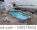 A swimming pool on the deck of a cruise ship 140574018
