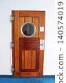 Wooden door on the deck of the cruise ship 140574019