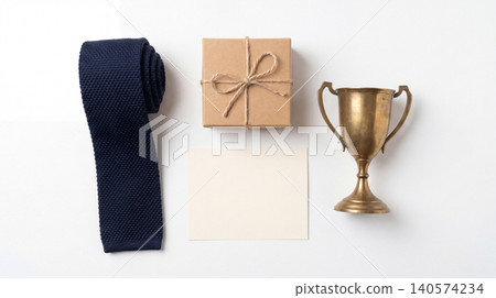 Achievement conceptual still life with trophy gift box and necktie achievement business celebration congratulations minimalist background isolated professional menswear accessory corporate 140574234