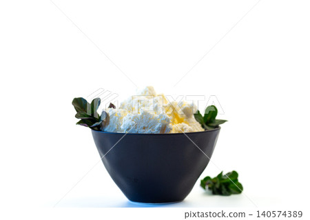 fresh homemade cottage cheese served in black bowl fresh homemade cottage cheese served in black bowl 140574389