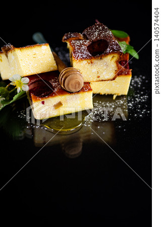 Sweet dairy casserole slices with berry filling and dark surface Sweet dairy casserole slices with berry filling and dark surface 140574404