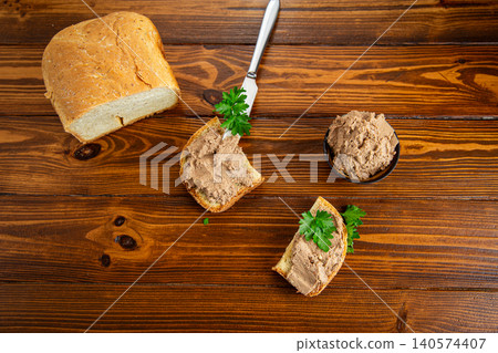 Rustic appetizer with liver pate and parsley garnish Rustic appetizer with liver pate and parsley garnish 140574407