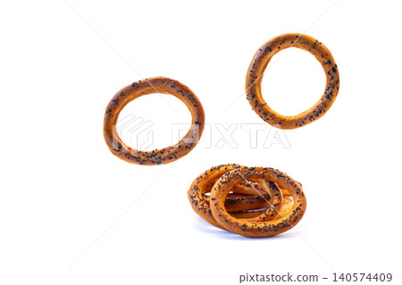Homemade ring bread with poppy seeds and shadows Homemade ring bread with poppy seeds and shadows 140574409