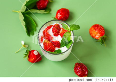 Delicious dairy dessert with strawberries and herbs Delicious dairy dessert with strawberries and herbs 140574413