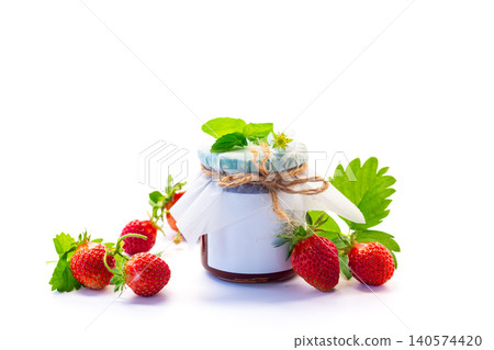 Homemade strawberry jam in glass jar arrangement Homemade strawberry jam in glass jar arrangement 140574420
