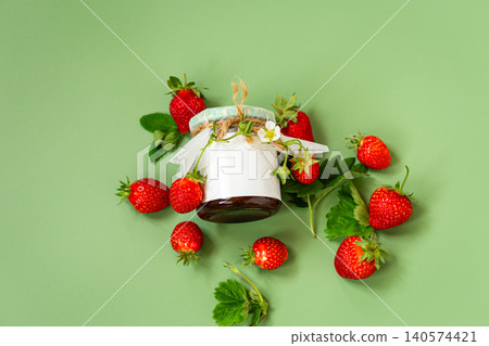 Top view of homemade strawberry jam with fresh strawberries and leaves Top view of homemade strawberry jam with fresh strawberries and leaves 140574421