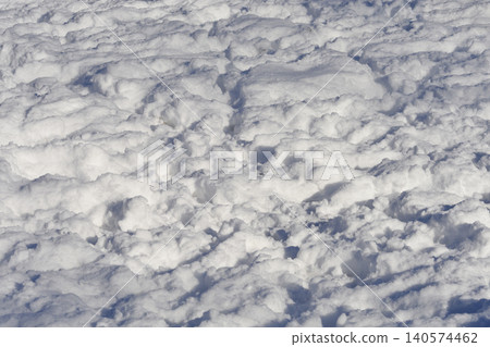 Textured deep snow surface background Textured deep snow surface background 140574462