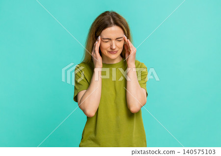 Woman holding head massaging temples in pain suffering from migraine intense sharp headache attack Woman holding head massaging temples in pain suffering from migraine intense sharp headache attack 140575103