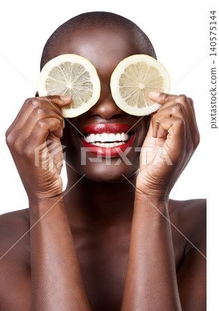 Black woman, smile and lemon skincare in studio in organic dermatology routine or wellness. White background, face and happy African model with facial fruit, diet food and eyes product for beauty Black woman, smile and lemon skincare in studio in organic dermatology routine or wellness. White background, face and happy African model with facial fruit, diet food and eyes product for beauty 140575144