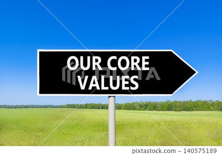 Our core values words symbol. Concept words Our core values on beautiful black road sign. Beautiful blue sky green field background. Business our core values motivational support concept. Copy space. Our core values words symbol. Concept words Our core values on beautiful black road sign. Beautiful blue sky green field background. Business our core values motivational support concept. Copy space. 140575189