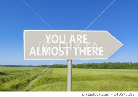 You are almost there symbol. Concept words You are almost there on beautiful grey road sign. Beautiful blue sky background. Business You are almost there motivational support concept. Copy space You are almost there symbol. Concept words You are almost there on beautiful grey road sign. Beautiful blue sky background. Business You are almost there motivational support concept. Copy space 140575192