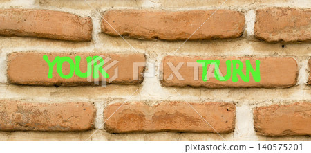Your turn words symbol. Concept words Your turn on beautiful brick wall. Beautiful brick wall background. Business your turn motivational support concept. Copy space. Your turn words symbol. Concept words Your turn on beautiful brick wall. Beautiful brick wall background. Business your turn motivational support concept. Copy space. 140575201