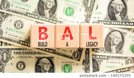 BAL build a legacy symbol. Concept words BAL build a legacy on beautiful wooden blocks. Beautiful dollar bills background. Business BAL build a legacy concept. Copy space BAL build a legacy symbol. Concept words BAL build a legacy on beautiful wooden blocks. Beautiful dollar bills background. Business BAL build a legacy concept. Copy space 140575205