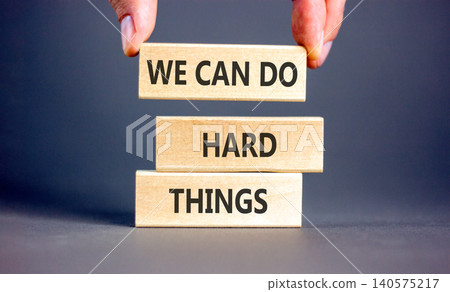 Support, help we can do hard things symbol. Concept words We can do hard things on beautiful wooden blocks. Beautiful grey background. Business we can do hard things concept. Copy space. Support, help we can do hard things symbol. Concept words We can do hard things on beautiful wooden blocks. Beautiful grey background. Business we can do hard things concept. Copy space. 140575217