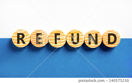 Refund word symbol. Concept word Refund on beautiful wooden circles. Beautiful blue and white background. Business word refund concept. Copy space. Refund word symbol. Concept word Refund on beautiful wooden circles. Beautiful blue and white background. Business word refund concept. Copy space. 140575230