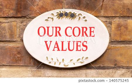 Our core values words symbol. Concept words Our core values on beautiful white sign plate. Beautiful brown brick wall background. Business our core values motivational support concept. Copy space. 140575245