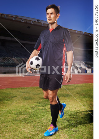 Man, exercise and confident soccer player in stadium, athlete and competitive for match or game. Male person, serious face and determined for competition, outdoors and focus for football challenge 140575250