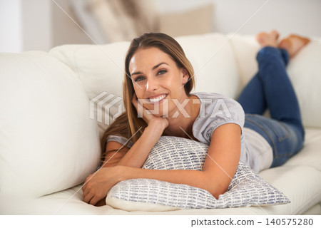 Portrait, happy woman and rest on sofa in living room, calm and peace on vacation in home. Face, wellness and young lady for relax on couch in lounge and satisfaction on weekend in modern apartment Portrait, happy woman and rest on sofa in living room, calm and peace on vacation in home. Face, wellness and young lady for relax on couch in lounge and satisfaction on weekend in modern apartment 140575280