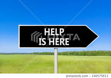 Help is here and support words symbol. Concept words Help is here on beautiful black road sign. Beautiful blue sky green field background. Business help is here and support concept. Copy space. Help is here and support words symbol. Concept words Help is here on beautiful black road sign. Beautiful blue sky green field background. Business help is here and support concept. Copy space. 140575611
