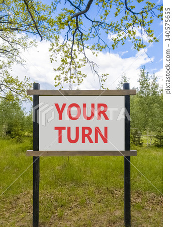 Your turn words symbol. Concept words Your turn on beautiful white road sign. Beautiful blue sky background. Business your turn motivational support concept. Copy space. Your turn words symbol. Concept words Your turn on beautiful white road sign. Beautiful blue sky background. Business your turn motivational support concept. Copy space. 140575655