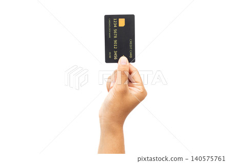 Hand holds credit card against plain white background. Simple composition draws focus to card details. Card shows generic numbers and chip symbol clearly. Hand presents card with gentle Hand holds credit card against plain white background. Simple composition draws focus to card details. Card shows generic numbers and chip symbol clearly. Hand presents card with gentle 140575761