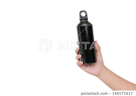 Hand holds sleek black water bottle. White background emphasizes product design. Simple, clean shot highlights portable hydration. Ideal for fitness, travel, or outdoor lifestyle themes Hand holds sleek black water bottle. White background emphasizes product design. Simple, clean shot highlights portable hydration. Ideal for fitness, travel, or outdoor lifestyle themes 140575817