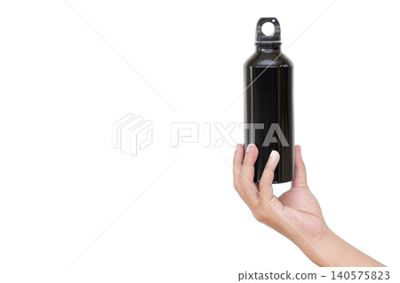 Hand holds sleek black water bottle. White background emphasizes product design. Simple, clean shot highlights portable hydration. Ideal for fitness, travel, or outdoor lifestyle themes Hand holds sleek black water bottle. White background emphasizes product design. Simple, clean shot highlights portable hydration. Ideal for fitness, travel, or outdoor lifestyle themes 140575823